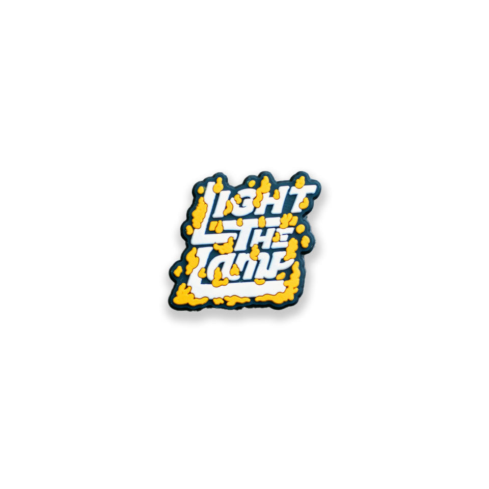 Light The Lamp Hockey Shoe Charm, front